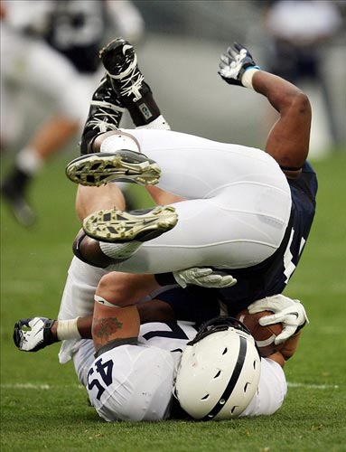 Stephen Obeng-Agyapong tackles fullback P.J. Meyers