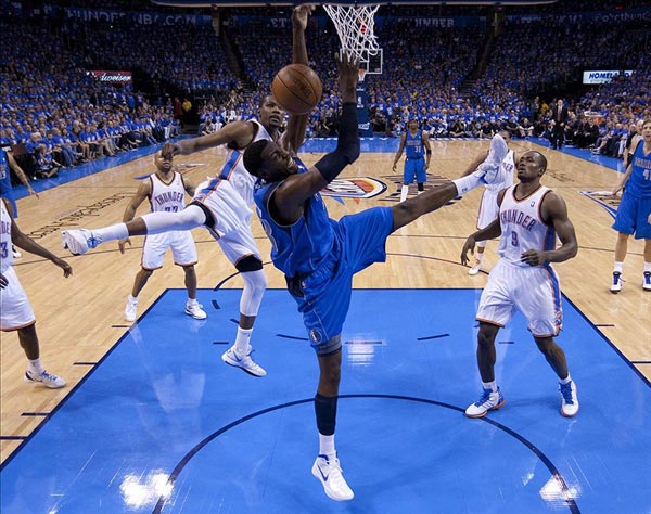 Dallas Mavericks center Ian Mahinmi shoots the ball against Oklahoma City Thunder small forward Kevin Durant